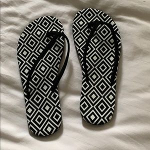Black and white pattern flip flops